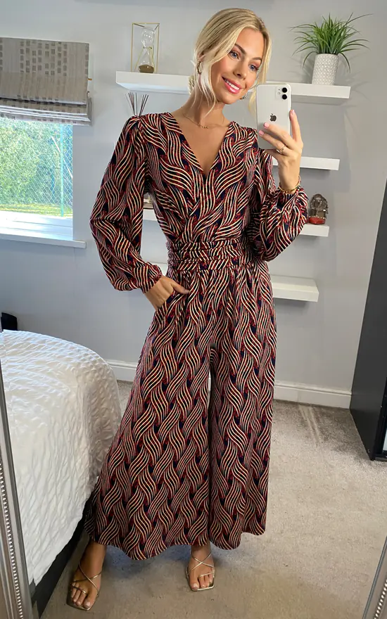 JOLIE MOI Devora Long Sleeve Jumpsuit In Red Multi 2 JOLIE MOI Devora Long Sleeve Jumpsuit In Red Multi - Image 2