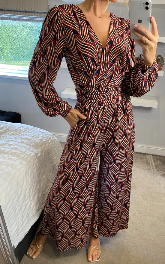JOLIE MOI Devora Long Sleeve Jumpsuit In Red Multi 3 JOLIE MOI Devora Long Sleeve Jumpsuit In Red Multi - Image 3